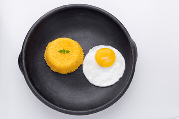 Brazilian Northeast Couscous (Cuscuz Nordestino). Maize couscous on white background