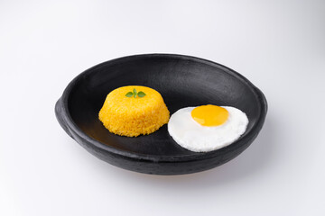 Brazilian Northeast Couscous (Cuscuz Nordestino). Maize couscous on white background