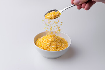 Brazilian Northeast Couscous (Cuscuz Nordestino). Maize couscous on white background
