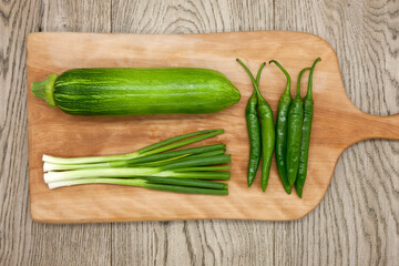 Green vegetables on cutting board