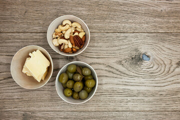 Various wine snacks on wooden table