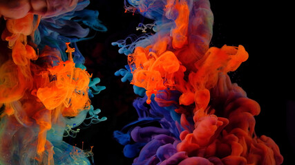 Color drops in water , abstract color mix , drop of Ink color mix paint falling on water Colorful...