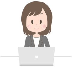 笑顔でノートパソコンを操作をするビジネスウーマン