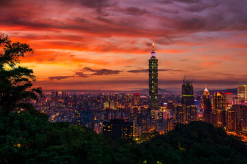 Panoramic aerial view of Downtown Taipei City at dusk, with Taipei 101 Tower in Xinyi Commercial District, Twilight capital city of Taiwan.