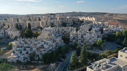 Fototapeta na wymiar Jerusalem orthodox neighborhood Ramot Polin hive buildings- Aerial Ramot polin is part of the larger neighborhood of Ramot, an Israeli settlement in northwest East Jerusalem 