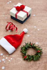 Various Christmas decorations on wooden background.