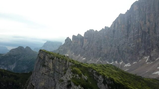 Green Valley Mountain ridge on a cloudy  day at Refugio Tisse near Alleghe village, Dolomites, Italy