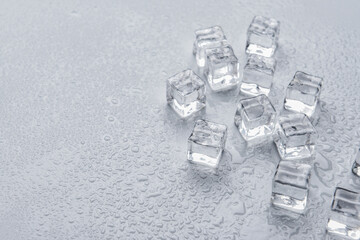 Ice cubes on grey background