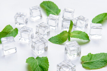 Ice cubes and mint on light background