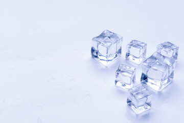 Ice cubes on light background
