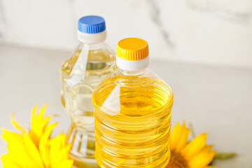 Bottles of sunflower oil on table, closeup