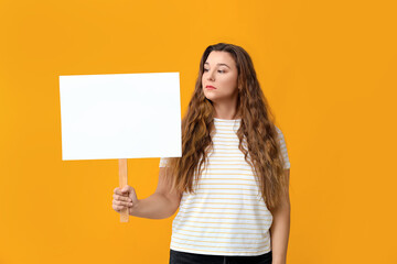 Obraz na płótnie Canvas Protesting woman with placard on color background