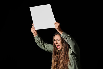Protesting woman with placard on dark background