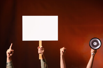 Protesting people with megaphone and placard on dark background