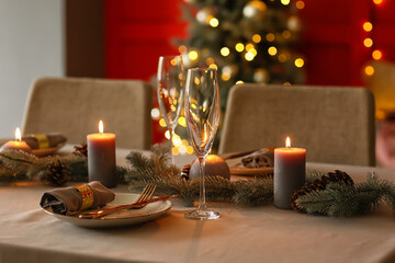 Beautiful table setting with Christmas decorations in living room