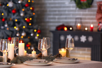 Beautiful table setting with Christmas decorations in living room