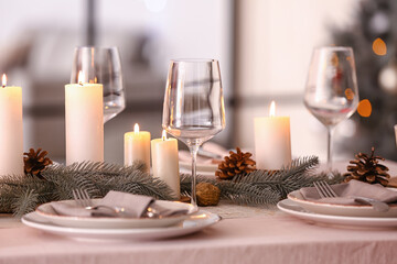 Beautiful table setting with Christmas decorations in living room