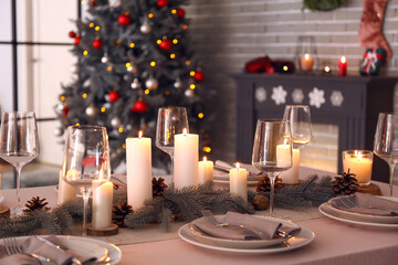 Beautiful table setting with Christmas decorations in living room