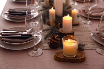 Beautiful table setting with Christmas decorations in living room, closeup
