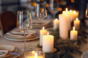 Beautiful table setting with Christmas decorations in living room, closeup