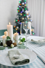 Beautiful table setting with Christmas decor in living room