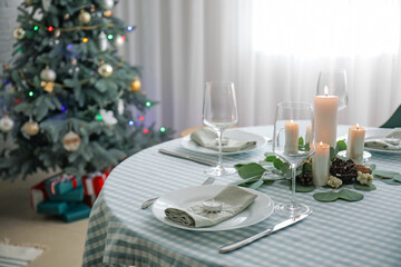 Beautiful table setting with Christmas decor in living room