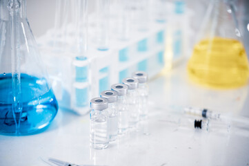 Various tools and containers used in experiments. Vaccine development concept.