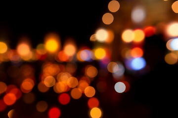 Christmas and Happy new year on blurred bokeh lights on black background.