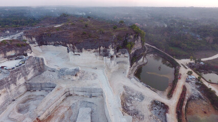 aerial view of Jaddih, a white limestone hill in Bangkalan, Madura, East Java, Indonesia. The...