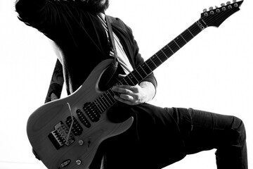 Male musician with guitar music rock star light background
