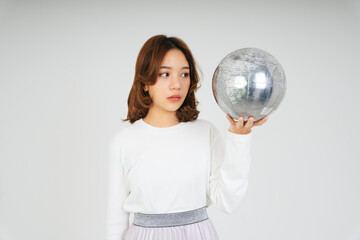 Asian woman with silver globe ball isolate on white background.