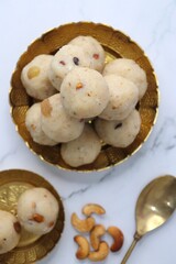 Rawa Ladu, Rava coconut Laddu or Semolina balls. It's a sweet dish from Maharashtra, India. Made using semolina, coconut & sugar. Its famous for festivals like, Diwali, Dussehra, Navratri. copy space