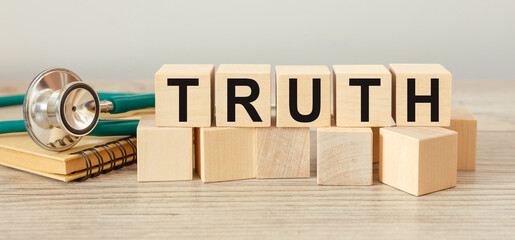 Wooden cubes with the abbreviation TRUTH