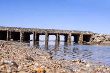 Underwater bridge covered with oyster shell.