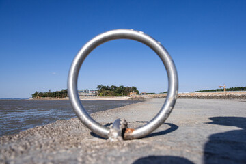 the landscape of seashore through the rounding ring.
