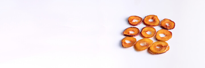 Obraz na płótnie Canvas slices of dried plum on a white background. dried fruits. eco.top view.