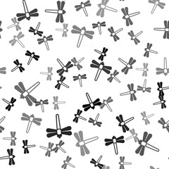 Black Dragonfly icon isolated seamless pattern on white background. Vector.