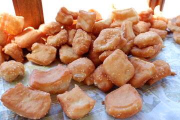 Odading is a fried cake with sesame seeds on the outside. This food is from West Java, Indonesia.