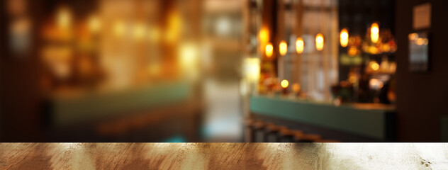 top of wood table with blur light in pub or bar night party banner background