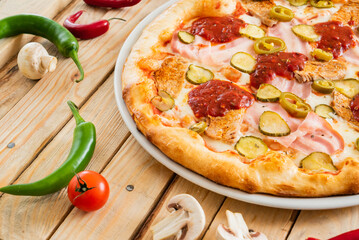 tasty pizza on the wooden background