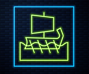 Glowing neon line Ancient Greek trireme icon isolated on brick wall background. Vector.