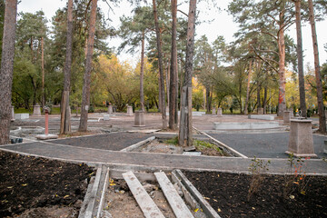 The process of reconstruction of the city park, work on the walking path
