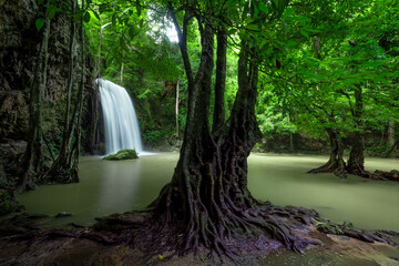 A beautiful waterfall deep in the tropical forest, steep mountain adventure in the rainforest.