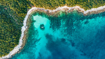 Drone view of the seashore with a boat at Cisterna beach Rovinj Croatia © Hakan Ozturk