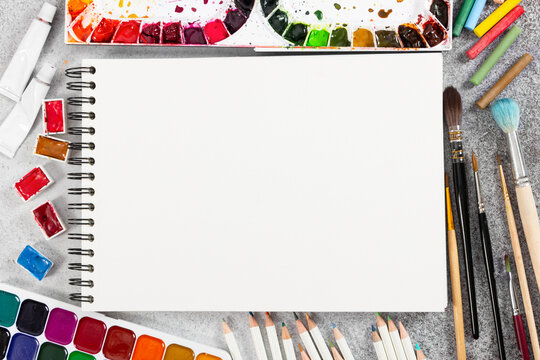 Artist workspace on gray stone background.