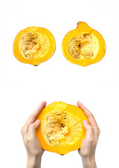 Set of pumpkin cut in half. Half pumpkin in hands on white background