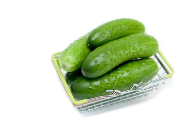 cucumbers in a basket on a white background