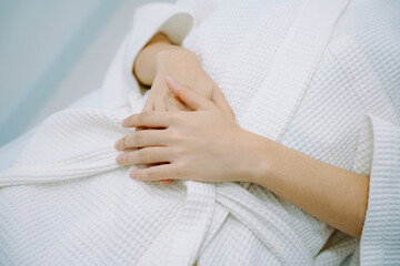 Hand of woman customer on beauty clinic waiting for spa treatment.