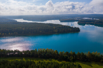 Drones panorama in the autumn lake landscape of the Upper Palatinate with turquoise blue water and sun reflections