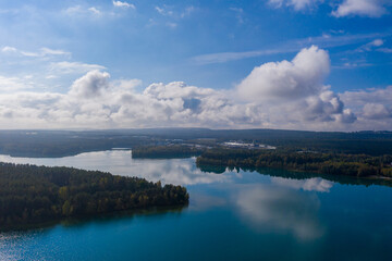 Drones panorama in the autumn lake landscape of the Upper Palatinate with turquoise blue water and sun reflections